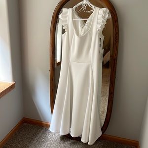 White high waisted Calvin Klein with ruffle sleeves and zipper back